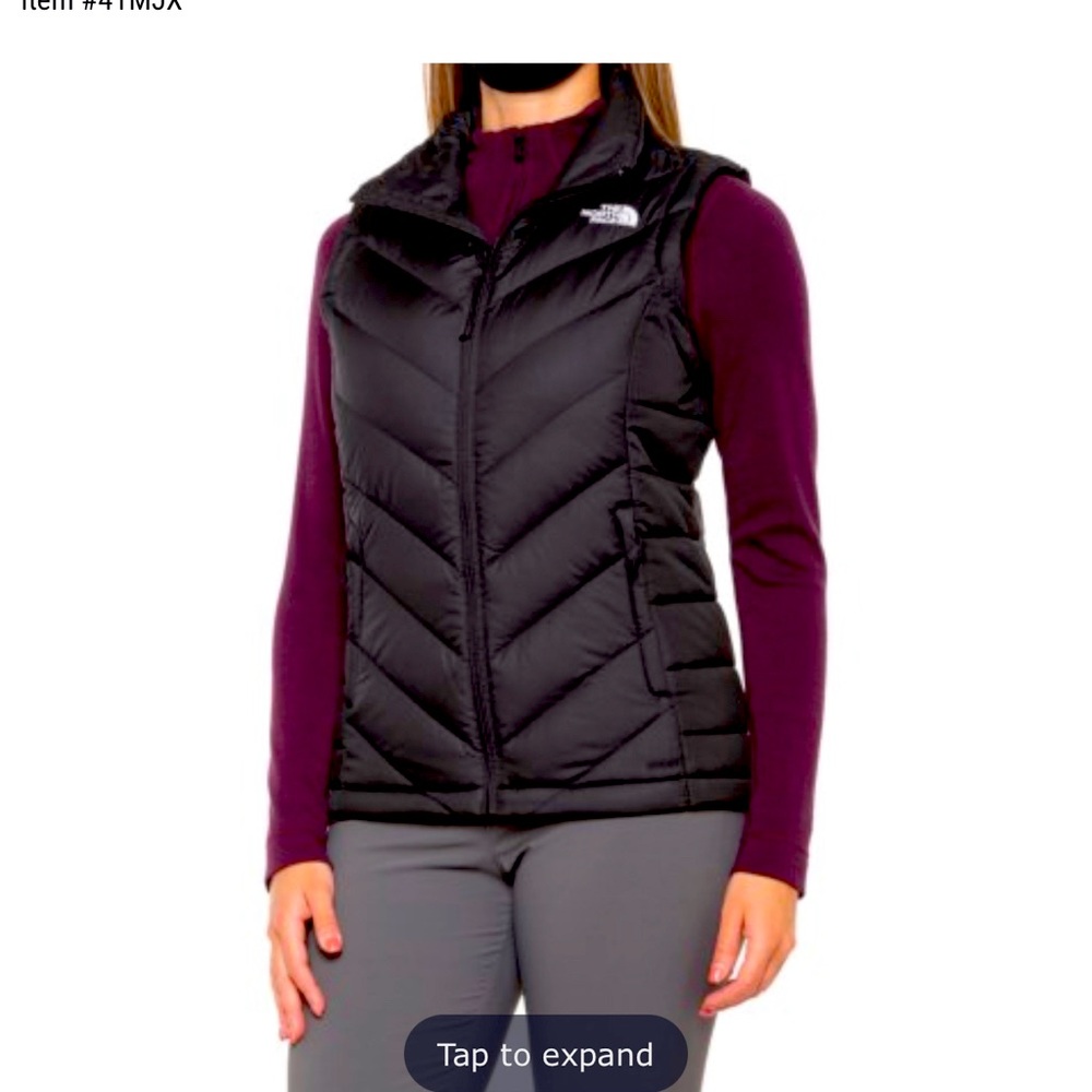 Black north face size medium down puffer vest 550. Never worn new without tags.